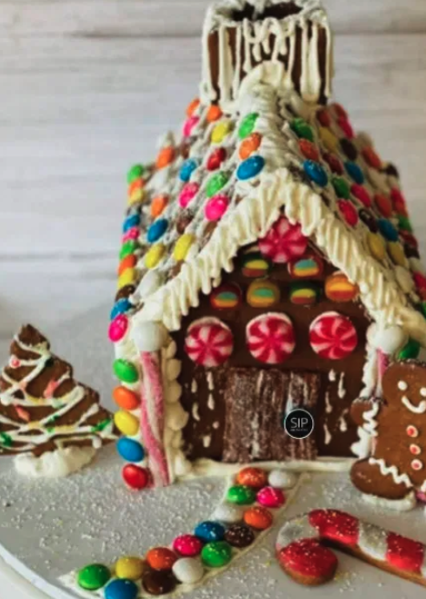 Decorated gingerbread house from a past Sip and Paint .NG session