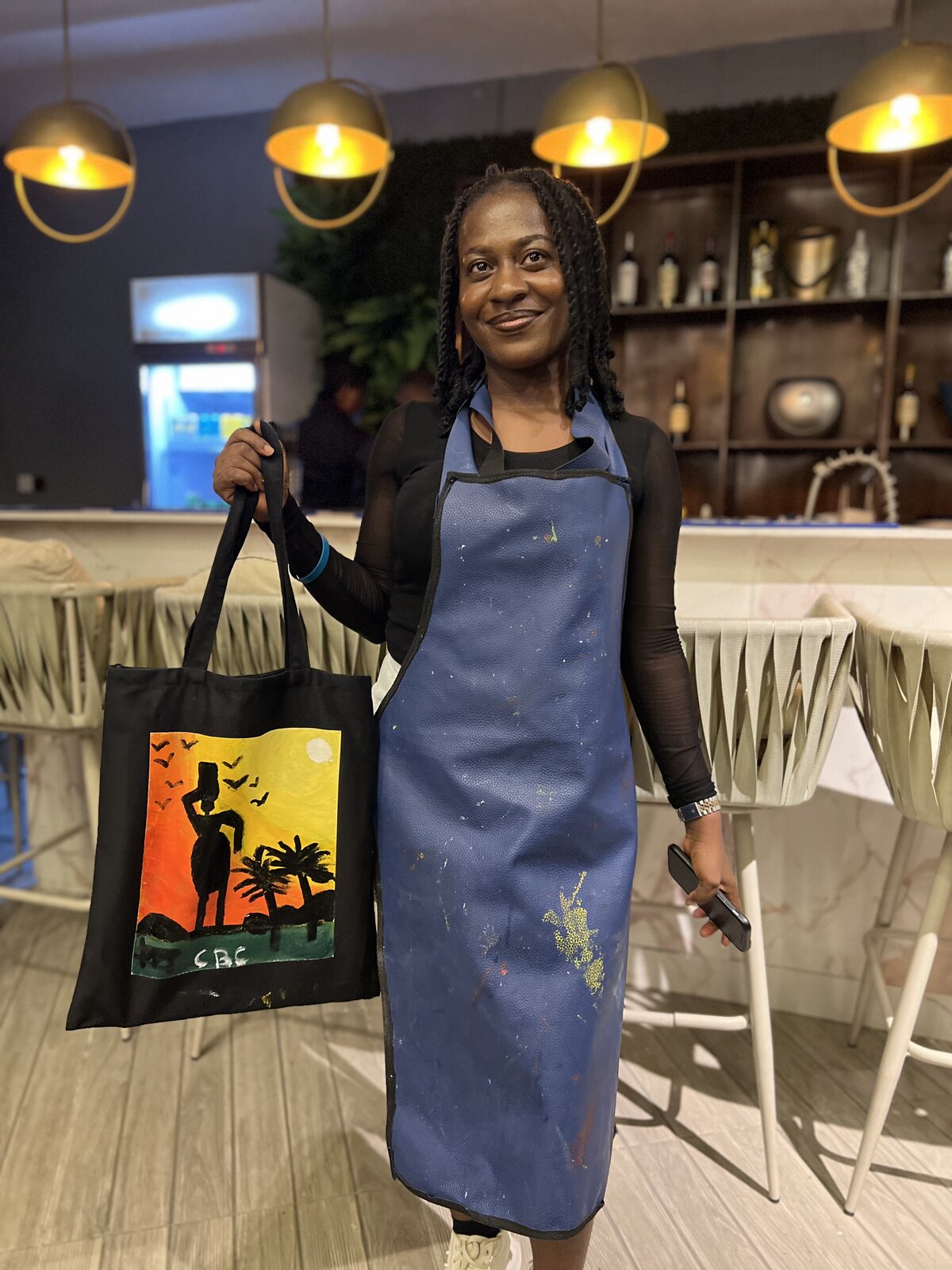 Painted tote bags from a Sip and Paint .NG session at The Art Hotel